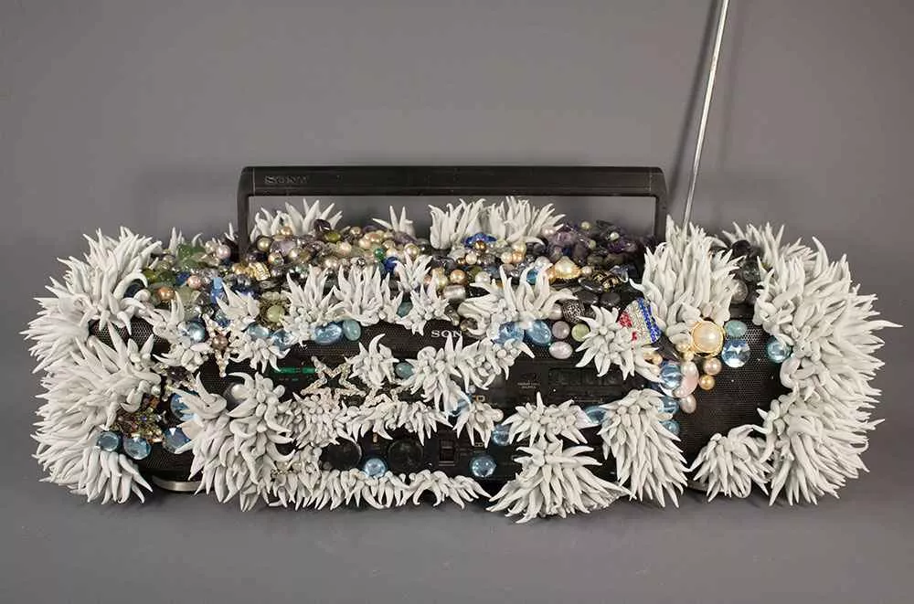 Boombox, 10” x 26.5” x 10.5”, resin, debris, beads by Tania Dibbs